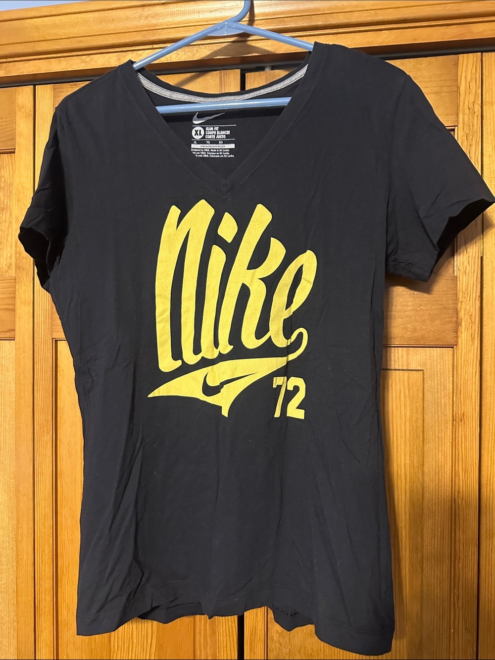 Nike Women's Black V-Neck Tee with Yellow Logo